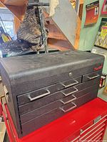 Front view of Torin black steel tool chest showing drawers and lock