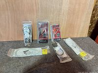 All five packaged firearm accessories displayed