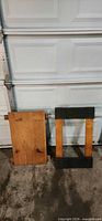 Both dollies front view leaning against garage door
