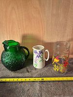 Three pitchers side by side for scale