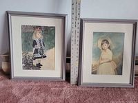 Two framed girl portraits with ruler for scale