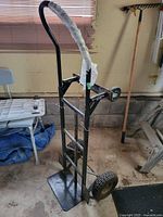 Hand truck showing frame, handle, wheels and toe plate