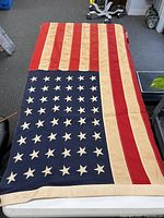 Full view of 48-star flag laid flat