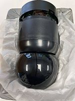 Black/grey dome camera resting in packaging