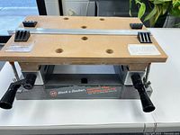 Overall view of Black & Decker bench top Workmate with MDF top, clamping dogs, crank handles