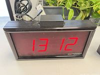 Front view showing red LED display and casing