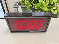 Front view showing LED display at 0000