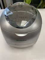 Front view of Brookstone ultrasonic cleaner showing exterior housing and lid