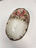 Top view of Capodimonte porcelain jewelry dish showing interior and floral decoration