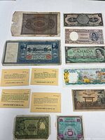 All eight banknotes laid out on white surface