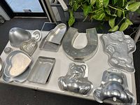 All pans laid out on table