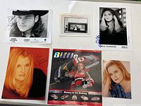 All six signed prints laid out on table