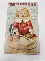Full view of Ludington Woodenware tin sign, shows entire design and text