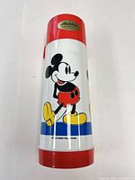 Full view of thermos front showing Aladdin logo and Mickey graphic