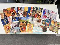 All magazines and postcards spread on table