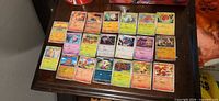 All 20 cards laid out in three rows on tabletop; shows overall condition and mix of types