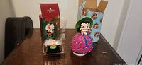 Both Betty Boop ornaments with boxes displayed on table