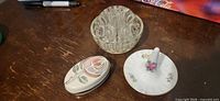 All three items: glass flower frog, porcelain ring dish, porcelain trinket box