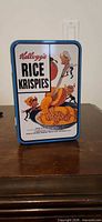 Front of tin with Rice Krispies graphics