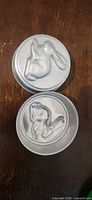 Two round aluminum bunny molds top view