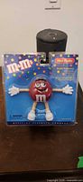 Front of sealed M&M mini radio blister pack