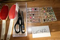 overview of lint brushes, scissors tray, bobbin case