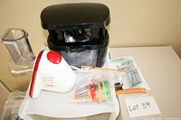 Entire lot showing Curtis Stone chopper, T-fal Fresh Express base, hopper, drums, manuals