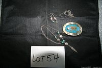 Overview of all four jewelry pieces on black cloth