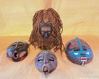 Group shot of all four African masks
