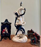 Group shot of lamp, wall plaque and pair of bookends