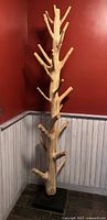 Entire tree-form coat rack showing full height and base