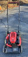 Front view of Craftsman red mower showing deck, engine cover, and handle