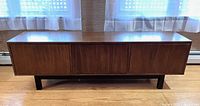 Front view of credenza showing three compartments and black base