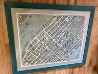 Full view of framed map showing overall condition, mat, frame, and map graphics