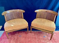 Front view of both chairs showing overall design and cushions