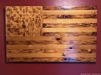 Front view of pine wood American flag showing full design and grain