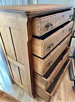 Dresser side view showing mission panels, drawer dovetails, brass pulls