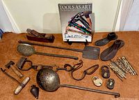 overview of all antique tools, shoe lasts, hobble, drill bits, book