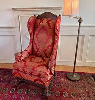 Front view of wing chair and floor lamp