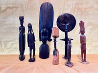 Group shot of all seven African carved figures