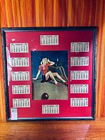 Full view of framed 1951 calendar with pin-up illustration and months