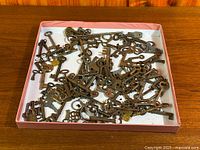 Box containing large quantity of antique skeleton keys