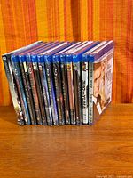 Stack of sealed Blu-ray cases showing spines