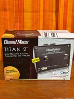 Front of retail box showing Channel Master Titan 2 CM-7777 preamplifier