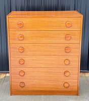 front view showing six drawers and round pulls