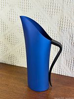 Full view of blue anodised jug on tabletop
