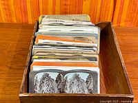 Tray holding large stack of stereoscopic view cards