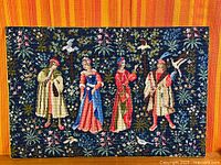 Full view of tapestry showing entire scene and border