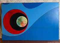 Full view of abstract blue painting with red, black and spherical elements