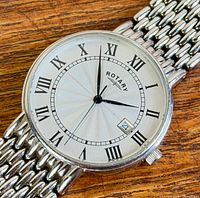 Close-up of watch face showing dial details and brand